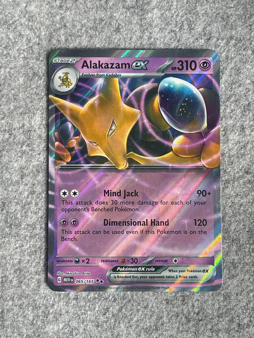 Alakazam EX MEW 065/165 är ett Pokémon-kort från setet 151.