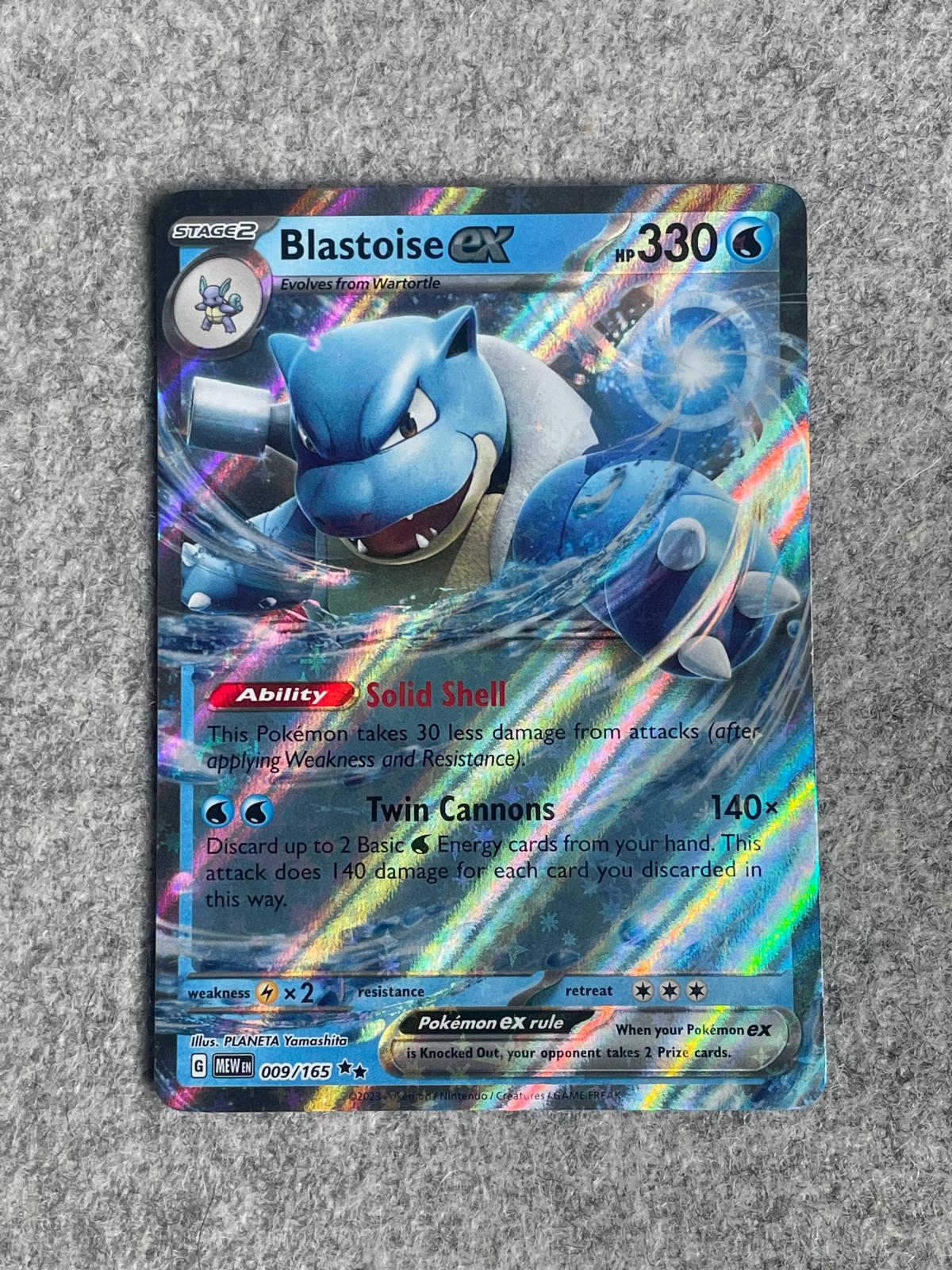 Blastoise EX MEW 009/165 är ett Pokémon-kort från setet 151.