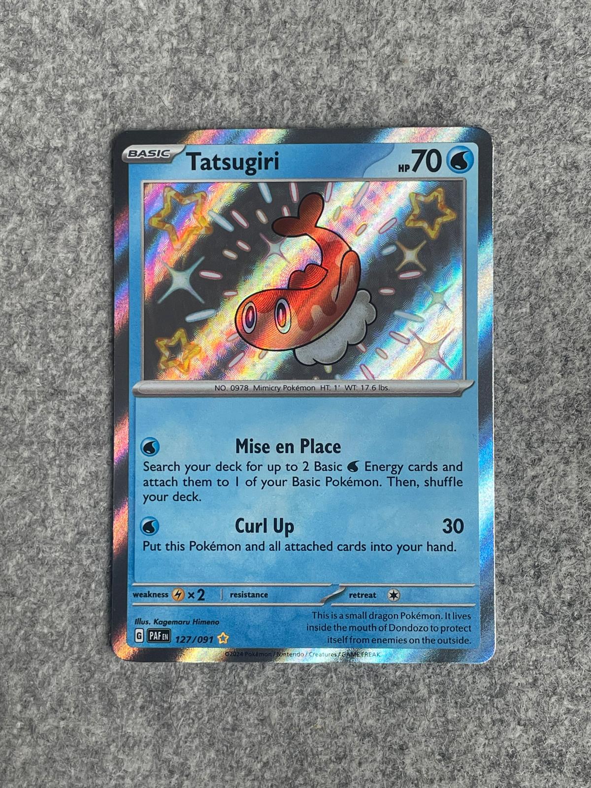 Tatsugiri PAF 127/091 är ett Pokémon-kort från setet Paldean Fates.